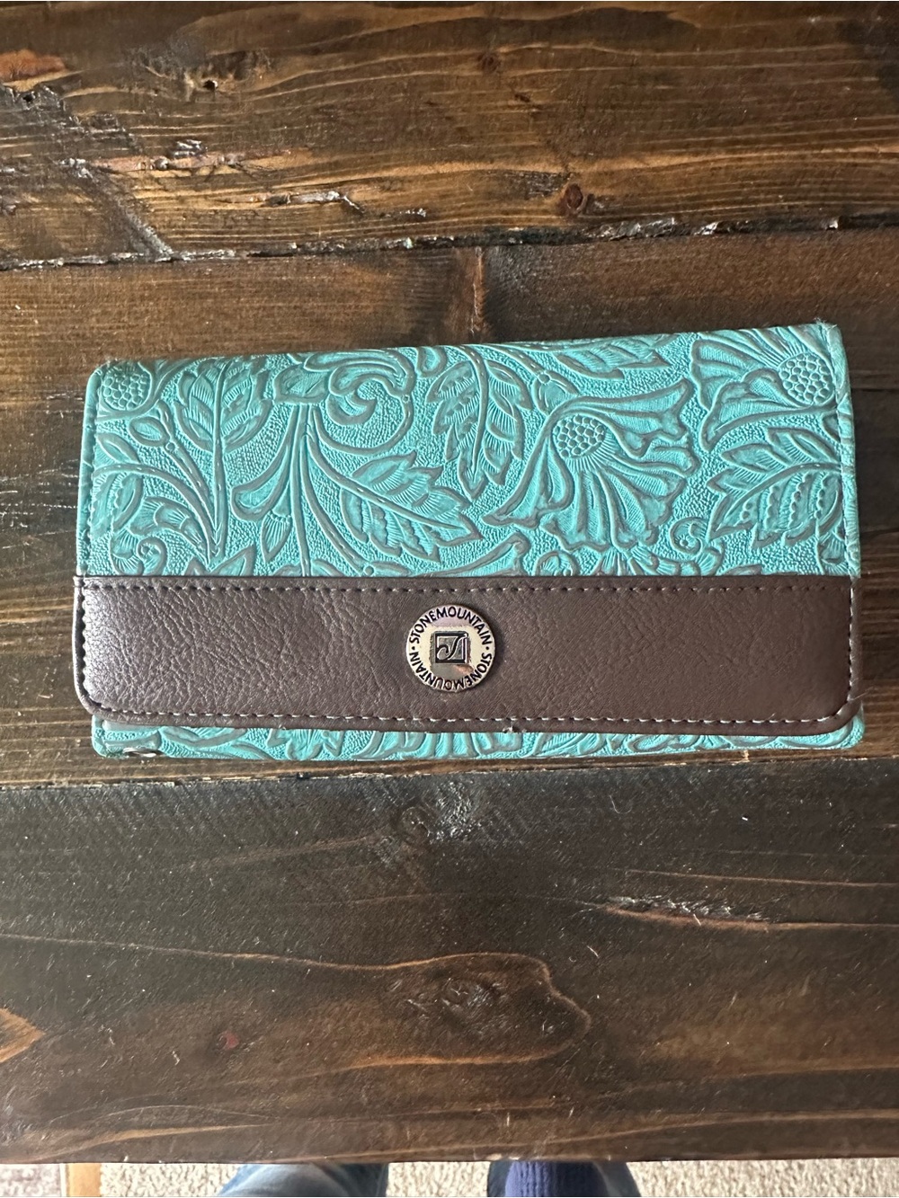 Stone Mountain wallet. Like new. Teal and brown